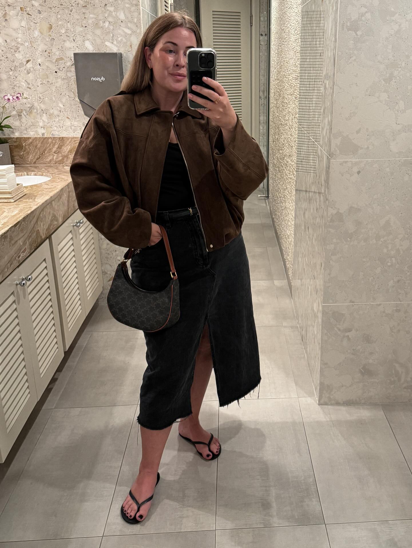 A Suede Bomber and Black Column Skirt: Brown-and-Black Dressing with a Relaxed Edge