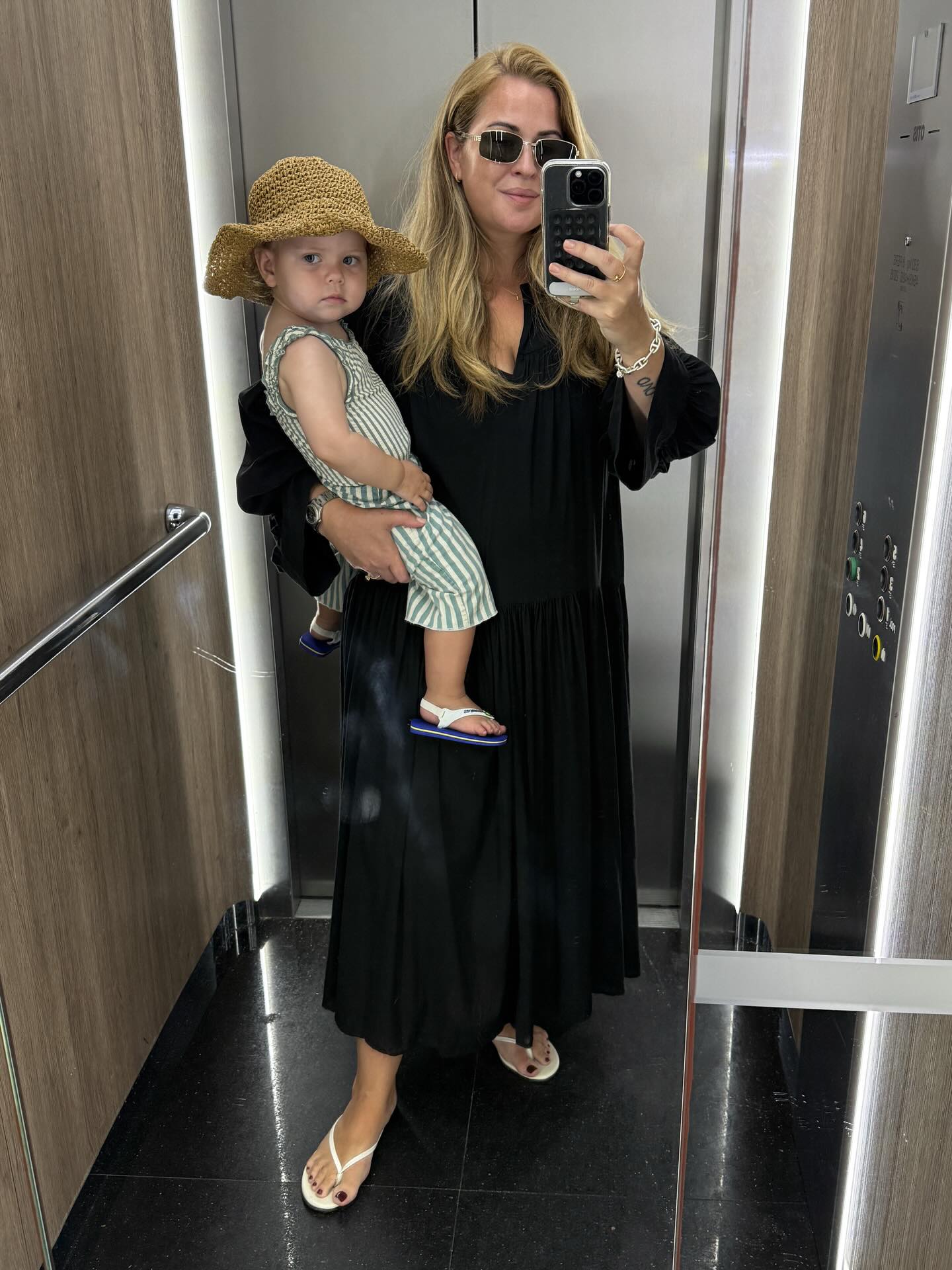 A Black Maxi Dress and Flat Sandals: The Easiest Quiet-Luxury Uniform for Warm Days